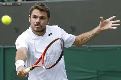 Wawrinka, Tsonga advance to second round at Wimbledon