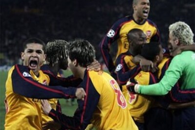 Arsenal triumph on penalties after Roman epic