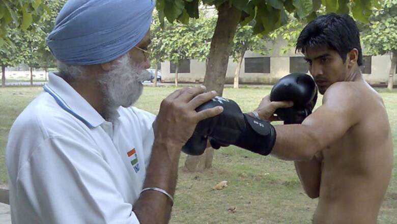 Boxing: Vijender, Suranjoy advance to semis