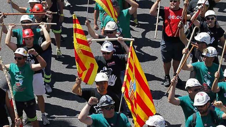 Spain unveils new austerity under pressure