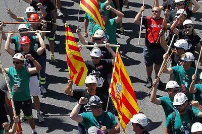 Spain unveils new austerity under pressure