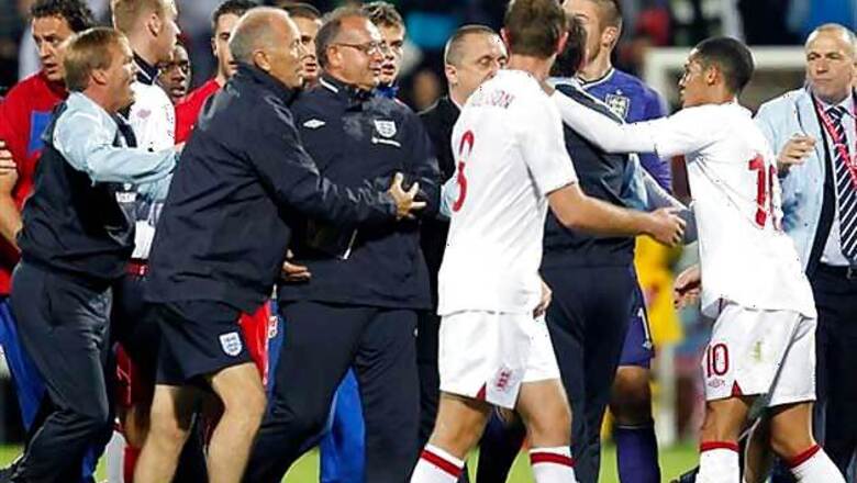 UEFA charges Serbia, England as police probe brawl