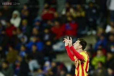 Lionel Messi assists keep Barcelona on course for trophies