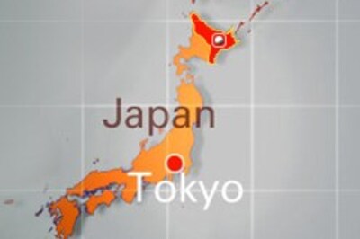 Japan tones down tsunami warning