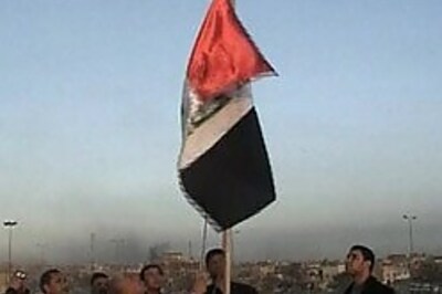 Iraq unfurls new flag to 'forget Saddam'