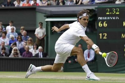 Federer sets Djokovic clash in Wimbledon semis