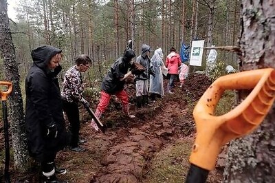 Bring Back The Bogs: Estonian Volunteers Get Hands Dirty In Climate Fight