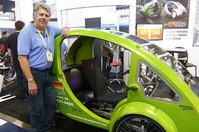 This Flintstones-like vehicle uses pedal power, battery propulsion, solar charging as fuel