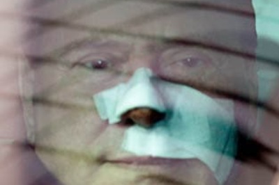 Berlusconi shops for 'daring' nudes, superman Obama