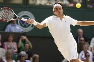 Federer ousts Karlovic, Haas topples Djokovic