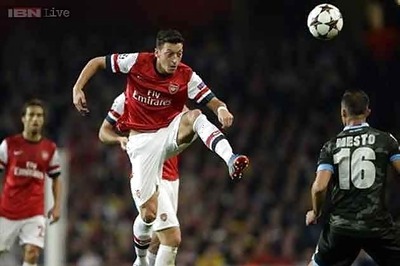 Euphoric Arsenal wary of Dortmund reality check