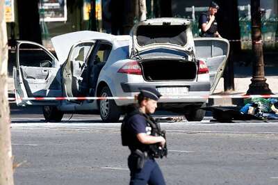 Champs Elysees attacker stashed weapons, was on French watchlist