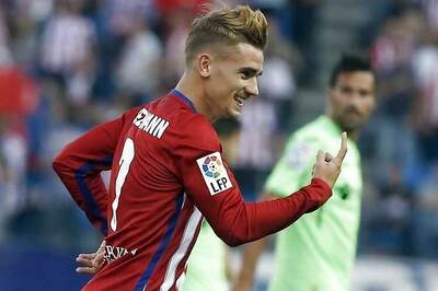 Griezmann double sends Atletico Madrid top of La Liga