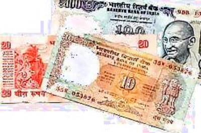 Rupee gains as dollar dips abroad