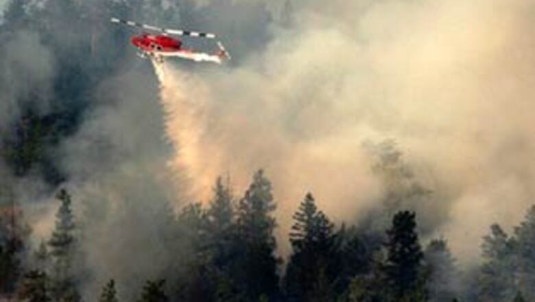 Thousands flee western Canadian wildfires