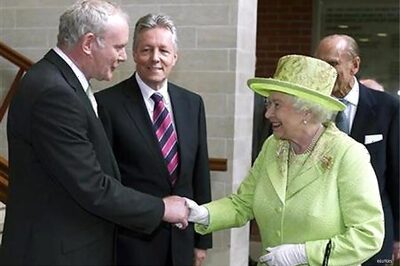 Britain's queen shakes hands with ex-IRA chief