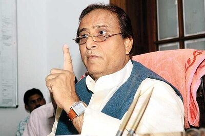 Azam Khan 'gifts' broom, pen to MLAs; taunts Modi