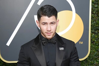 Nick Jonas Always Carries a Suit While Travelling