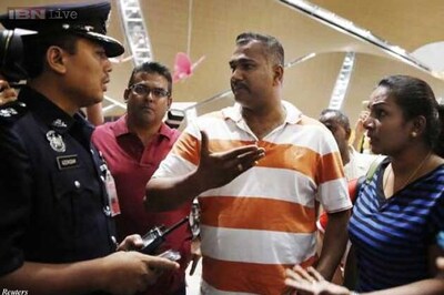 Relatives of passengers on downed Malaysian plane MH17 berate officials