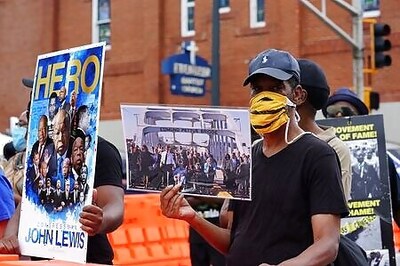 Civil rights icon John Lewis praised by past presidents at funeral
