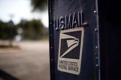 U.S. Postal Service puts changes on hold after mail-in voting outcry