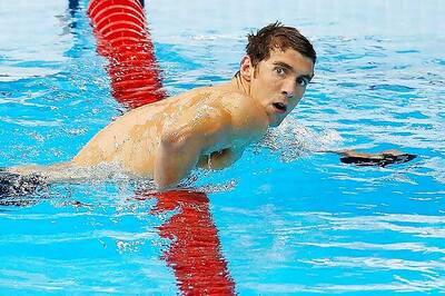 Michael Phelps comeback marches on with butterfly win