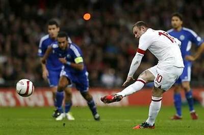 Rooney leads England to a thumping win over San Marino