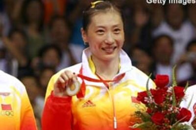 Zhang upsets top seed, wins badminton gold