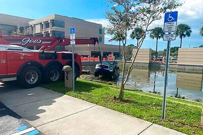 Truck Crashes Into Pond Outside Florida Courthouse