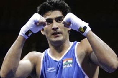 Vijender, Dinesh enter World Boxing quater-finals