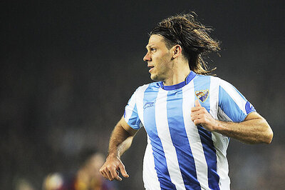 Malaga take control in Champions League play-off