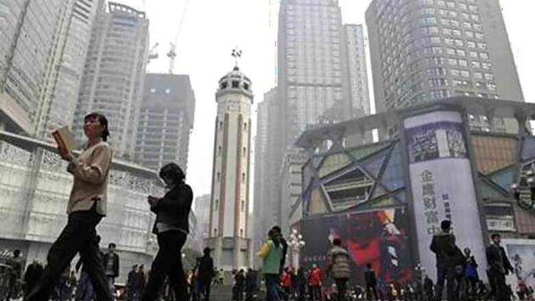 China's economy grows 7.7 per cent in 2013