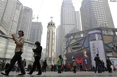 China's economy grows 7.7 per cent in 2013