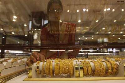 Gold touches new high at Rs 21,000 per gm