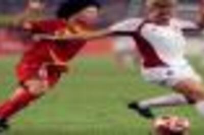 China grind out 1-1 draw with Canada in soccer