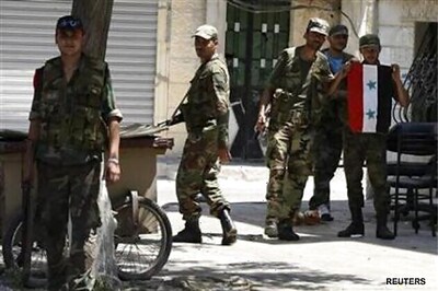 Syrian forces stretched, Assad's spy chief dead