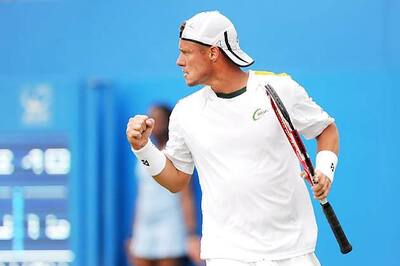 Lleyton Hewitt rallies past Michael Russell in Queen's 1st round