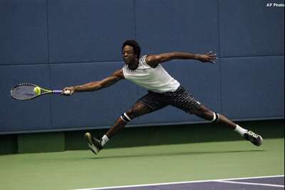 Monfils rallies, Berdych sails in Paris Masters