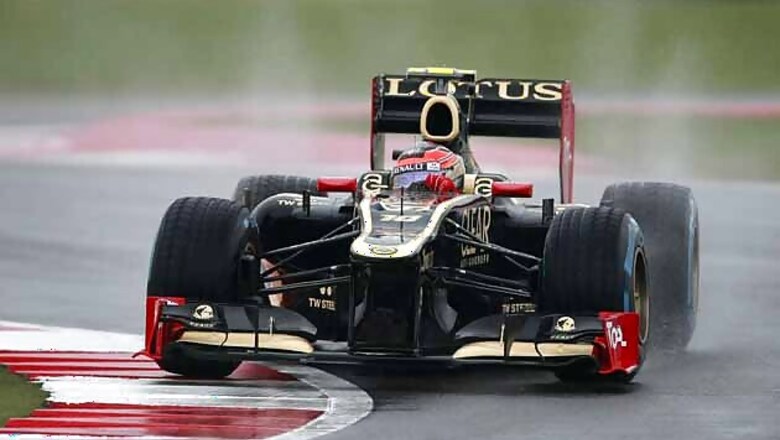 Grosjean fastest in wet practice for British GP