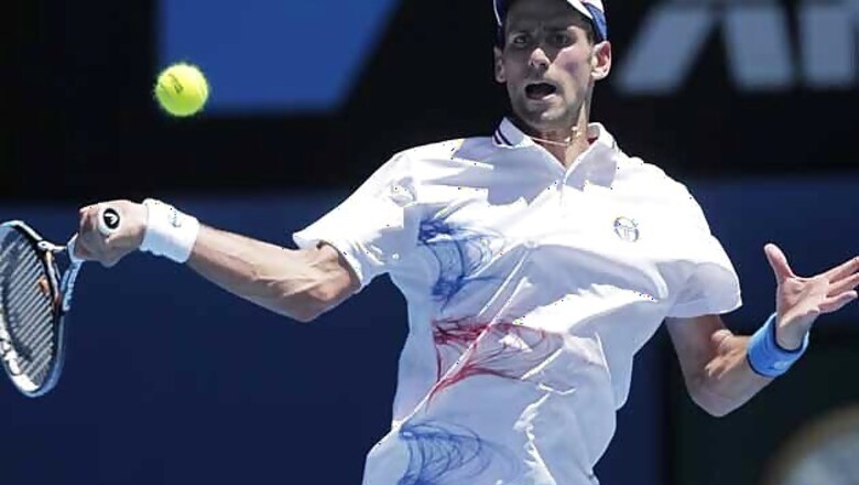 Djokovic advances on a rain-hit day