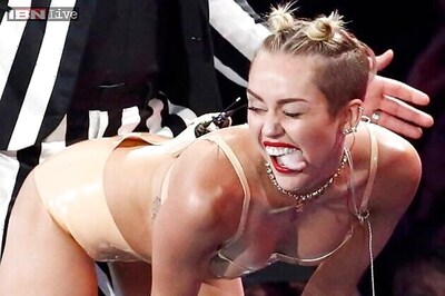 Miley Cyrus goes topless for a cause