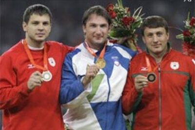 IOC strips 2 Belarusians of Olympic hammer medals