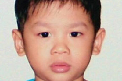 Jolie hugs, plays with adopted son