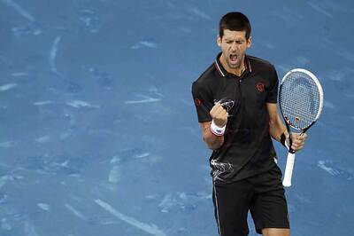 Unhappy Djokovic toils to advance in Madrid