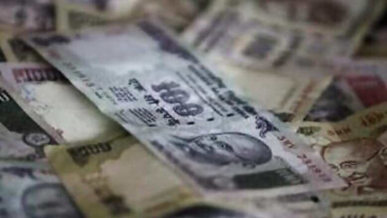 Rupee hits an all-time low of 57.12 against US dollar