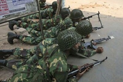 Rebel Bangladeshi soldiers begin laying down weapons