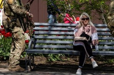 In Ukraine’s Russia-Occupied Cities, Sympathizers Make A Quick Buck While Russification Continues