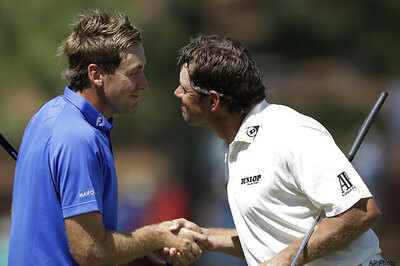 Poulter, Westwood in Masters lead